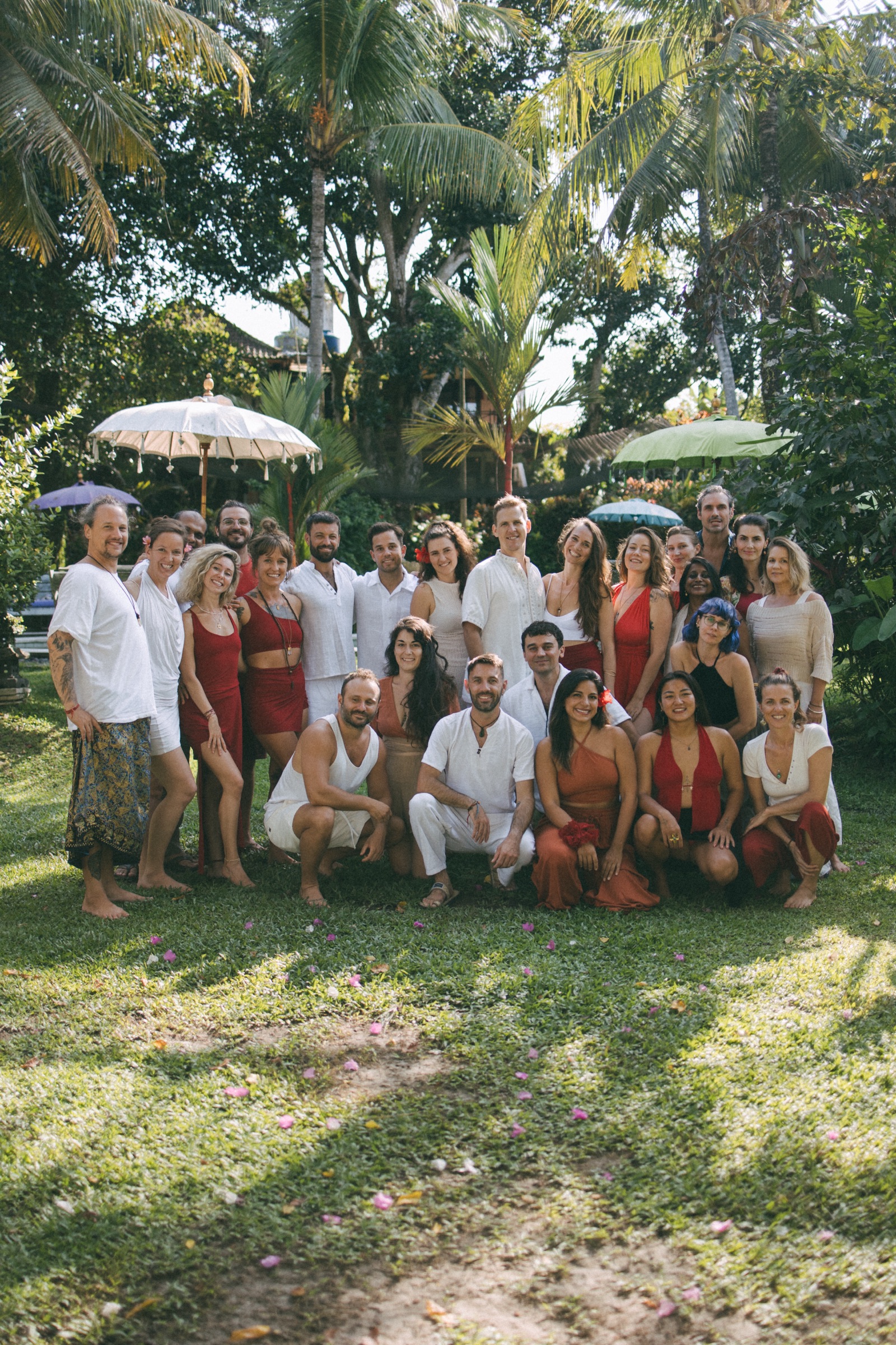 Christa's retreat group gathered together in a lush garden in Bali